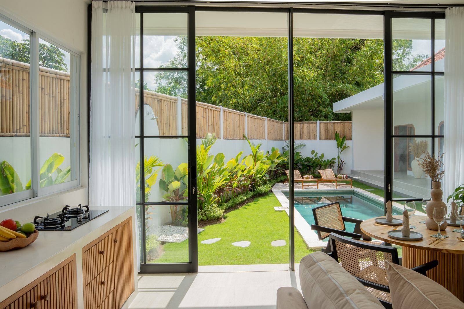 Kitchen and dining area facing the pool