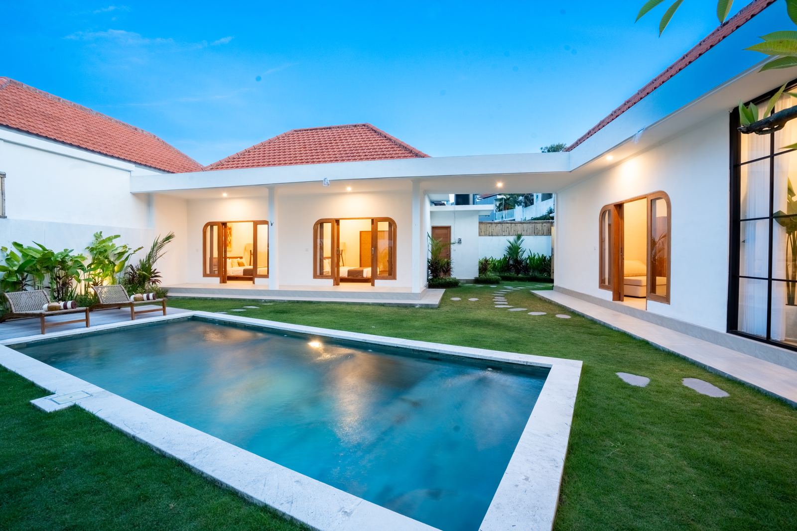 Villa Guerrero pool lit up in the evening on Jalan Padang Linjong, Canggu